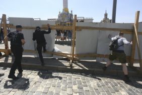 The activists destroy the fence