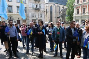 Participants in the opening ceremony of the symbolic street sign