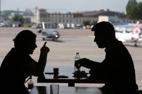 People are sitting at a table in a cafe. at the airport "Kiev"