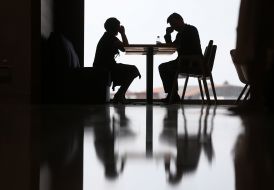 People are sitting at a table in a cafe. at the airport "Kiev"