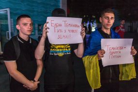 Participants hold posters