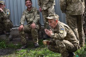 Military drinks coffee and smoke