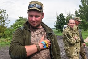 Flag and emblem painted on military arm