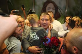 Mikheil Saakashvil hugs a boy