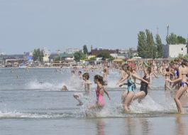 Children swim in the sea