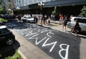 The inscription "We require the customer" on the asphalt