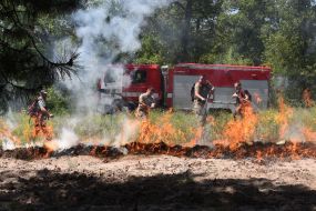 Rescuers extinguish the fire