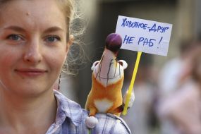Participant of the rally for the circus without animals with her dog