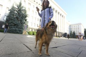 Participant of the rally for the circus without animals with her dog