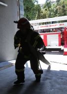 The rescuer is preparing to quench a conditional fire