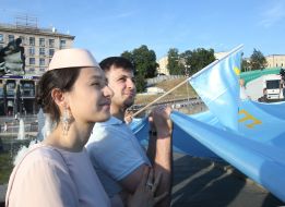 Rally participants hold the Crimean Tatar flag