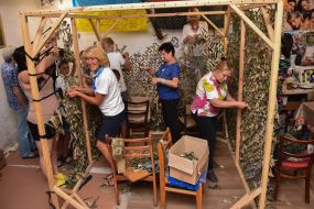 Activists make camouflage nets