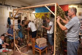 Activists make camouflage nets