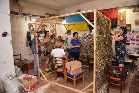 Activists make camouflage nets