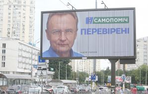 Billboard with the image of Andrey Sadovy