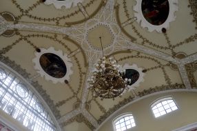 Ceiling murals and chandelier in the hall of the railway station Kharkov-Passenger