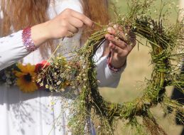 Weaving wreaths from field flowers