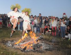 Young people jump over the fire