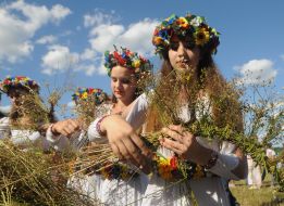 Weaving wreaths from field flowers