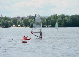 Athlete at sailing board (windsurfing)