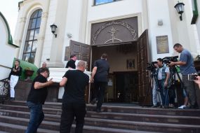 Men bring a coffin to the Holy Virgin Cathedral