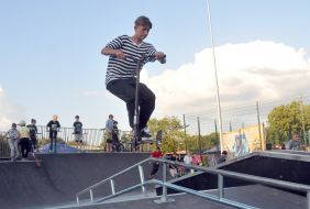 Teenager on skateboard jumps from a springboard