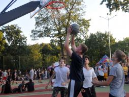 Students play street basketball