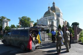 The priest blesses volunteer help