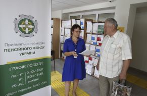 An employee of the PFCs and the visitor in the waiting room