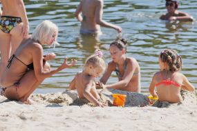 People relax on the beach