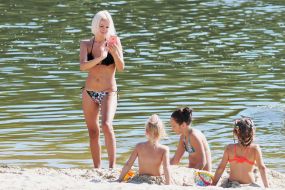 People relax on the beach