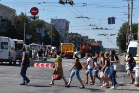 Pedestrians cross the road