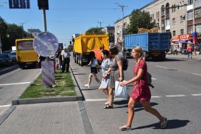 Pedestrians cross the road