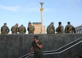 Soldiers rest after the rehearsal of the Dignity March