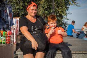 Boy with red hair eating ice cream