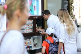 Man at a tobacco kiosk