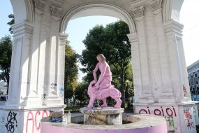 Painted in pink, the Samson fountain on Kontraktova square