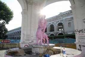 Painted in pink, the Samson fountain on Kontraktova square