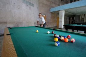 Man plays billiards