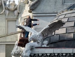 Experts examine the front of the House with chimeras