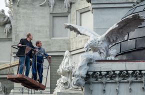 Experts examine the front of the House with chimeras