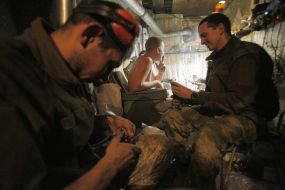 Ukrainian soldiers equip stores with ammunition