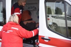 Doctors provide emergency assistance to victims of the An-12 transport plane crash