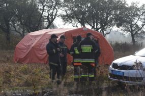 Rescuers are working on the site of the An-12 transport plane crash