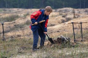 The boy is digging the ground