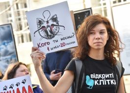 The participant of the action holds poster