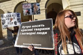 Participants of the action hold posters