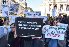 Participants of the action hold posters