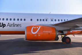 The plane of the Ukrainian Aviacompany SkyUp Airlines at the airport in Zaporozhye