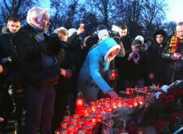 Woman puts a light bulb